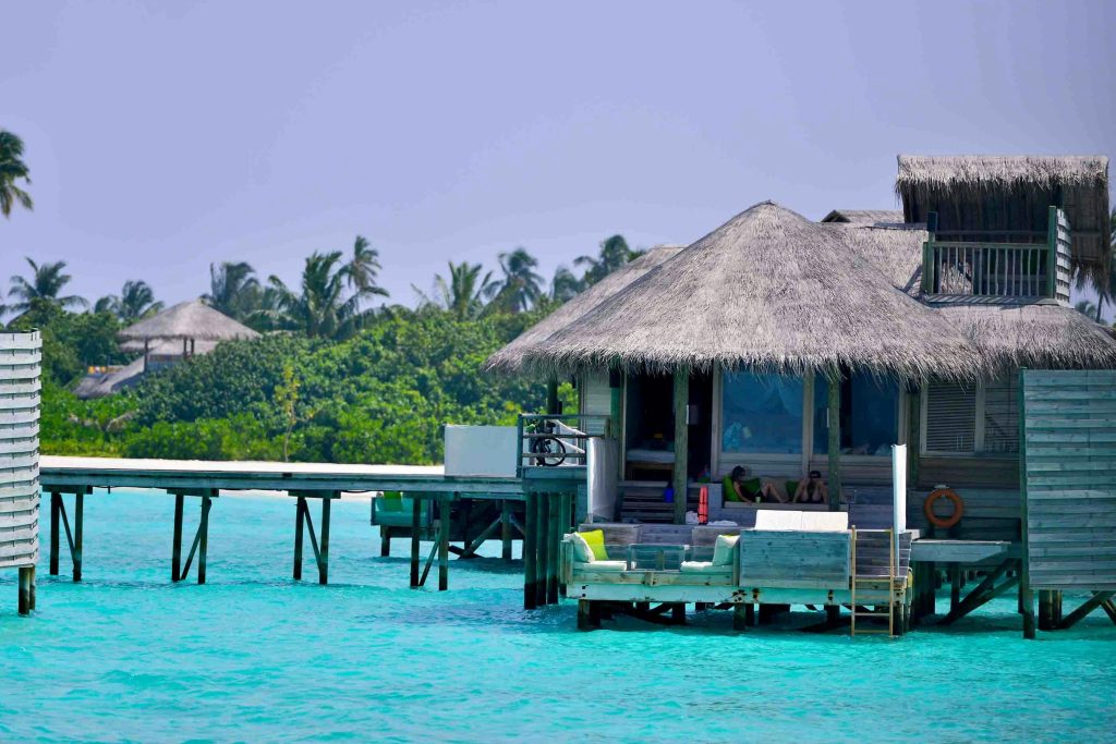 Idyllic overwater turquoise waters Maldives.